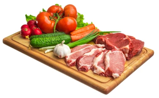 Raw Frozen Food and Vegetable preparation on cutting board